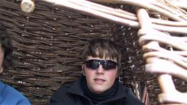 Ash and Lawrence try out the hanging willow basket at the Willow and Wetlands Visitor Centre, Stoke Gregory